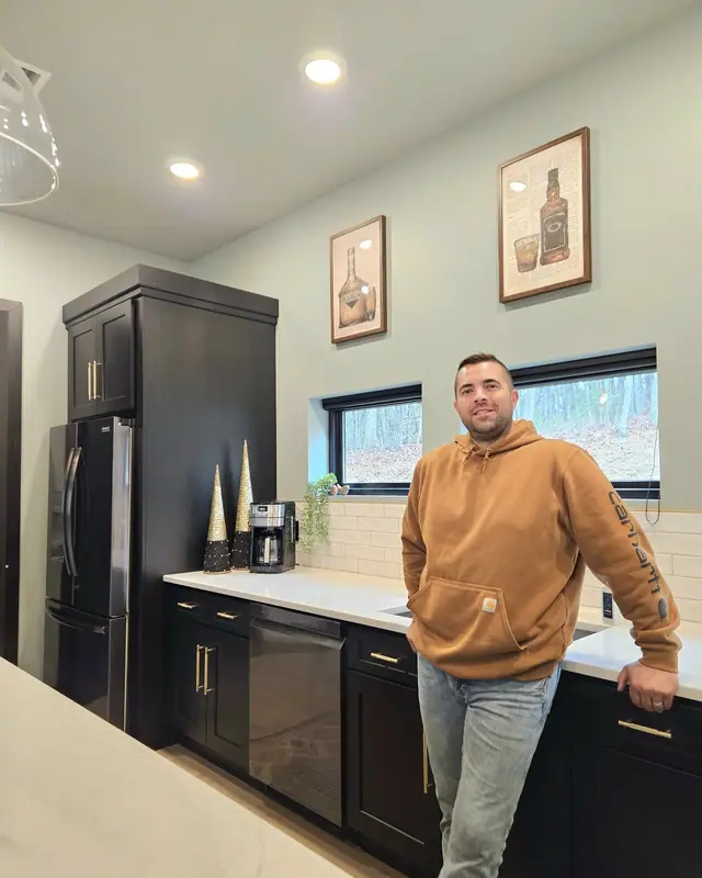 Dan LeClair of Master Hand Construction Services in a finished kitchen