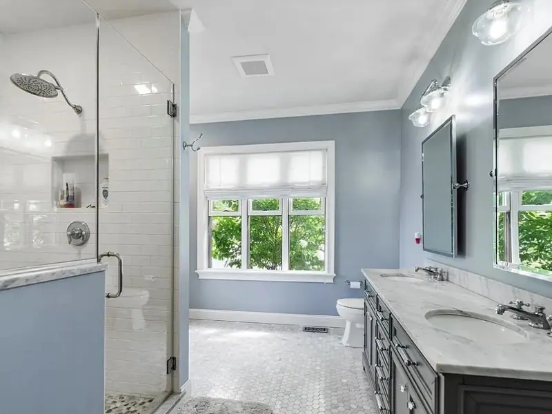 Bathroom with a glass walk-in shower and a grey double vanity