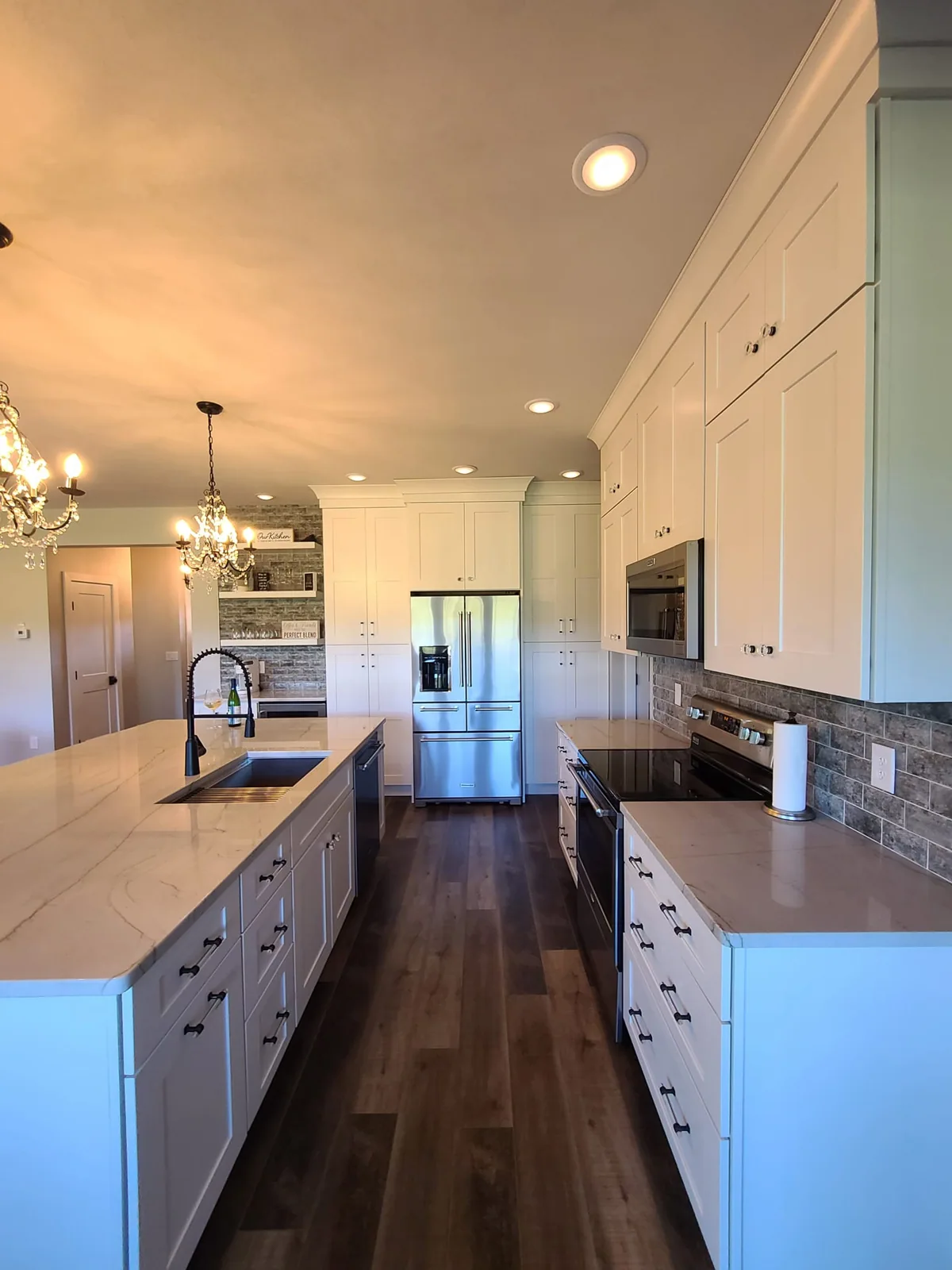 Kitchen work aisle connecting the sink and appliance areas in Central Square, NY.