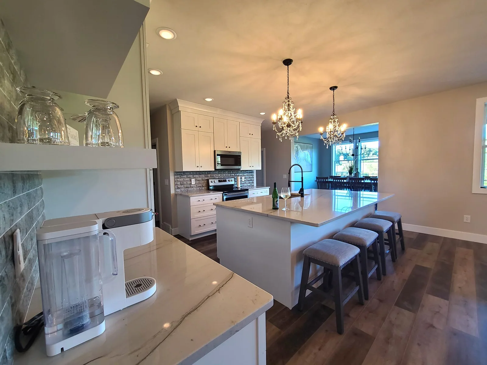 Kitchen island and beverage area viewed from the living room in Central Square, NY.