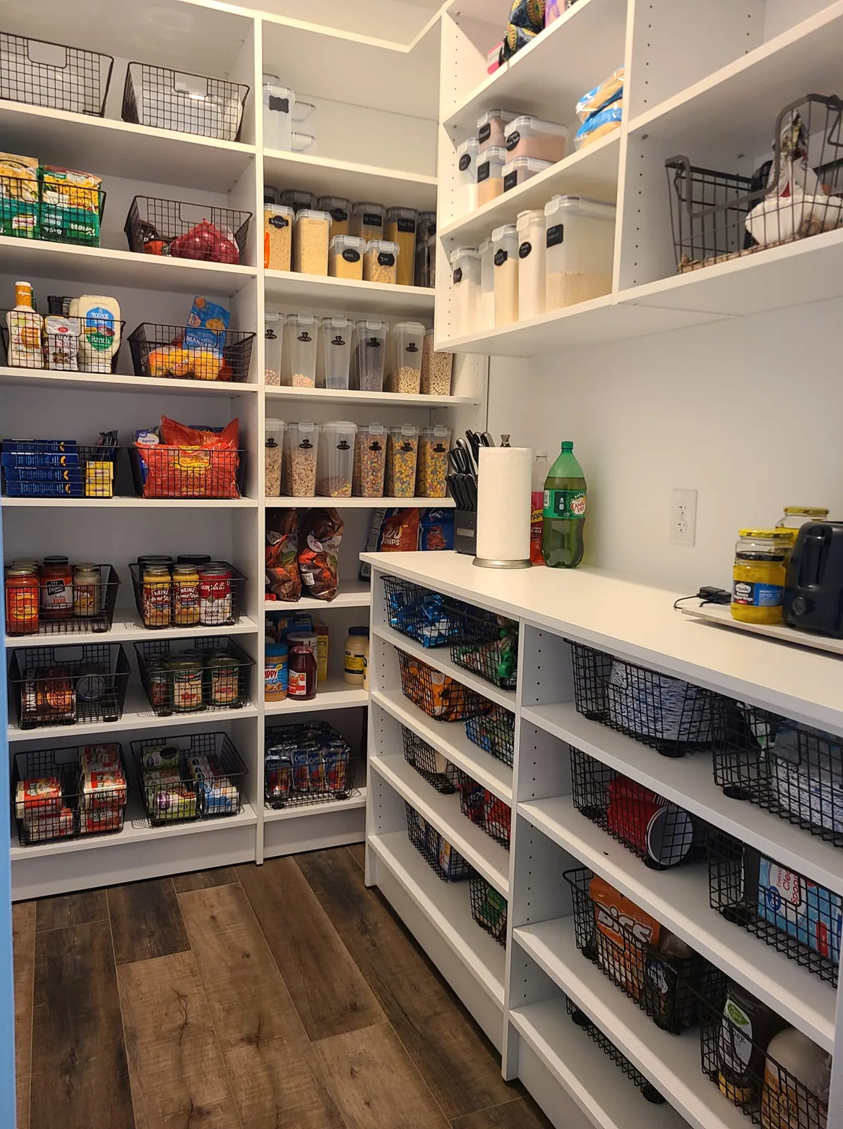 Walk-in pantry with open shelves and organized storage in Central Square, NY.
