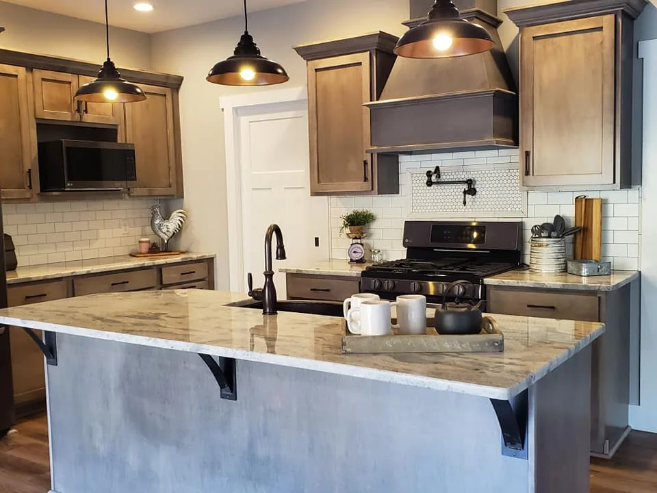 Farmhouse kitchen with two-tone cabinetry and an island in Central New York.