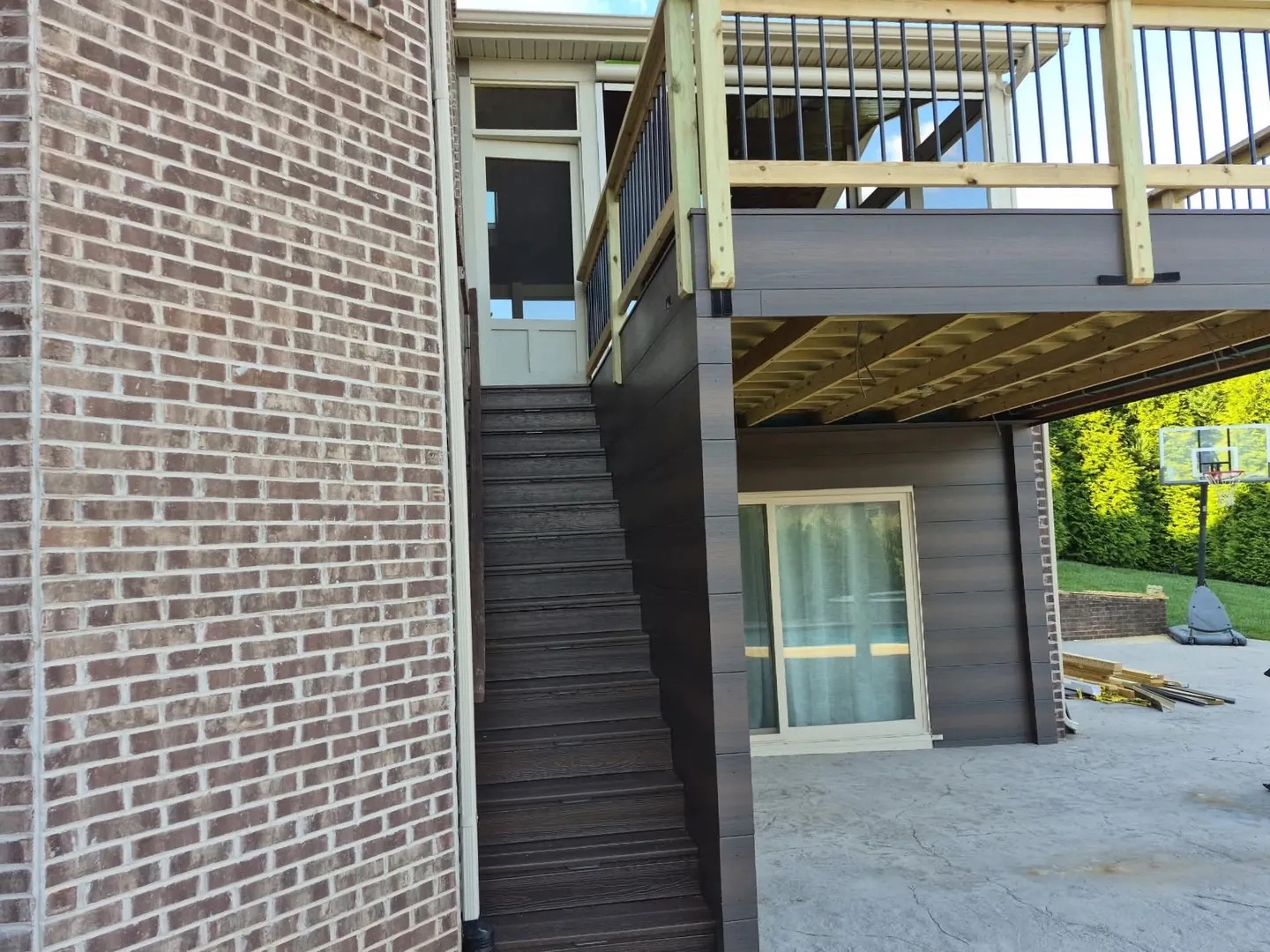 Stairs from the deck beside the wall that closes in the space beneath, in Farragut, TN.